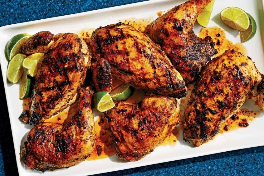 Jerk chicken là một món gà nướng cay, thơm và đậm đà hương vị, đặc trưng của ẩm thực Jamaica 